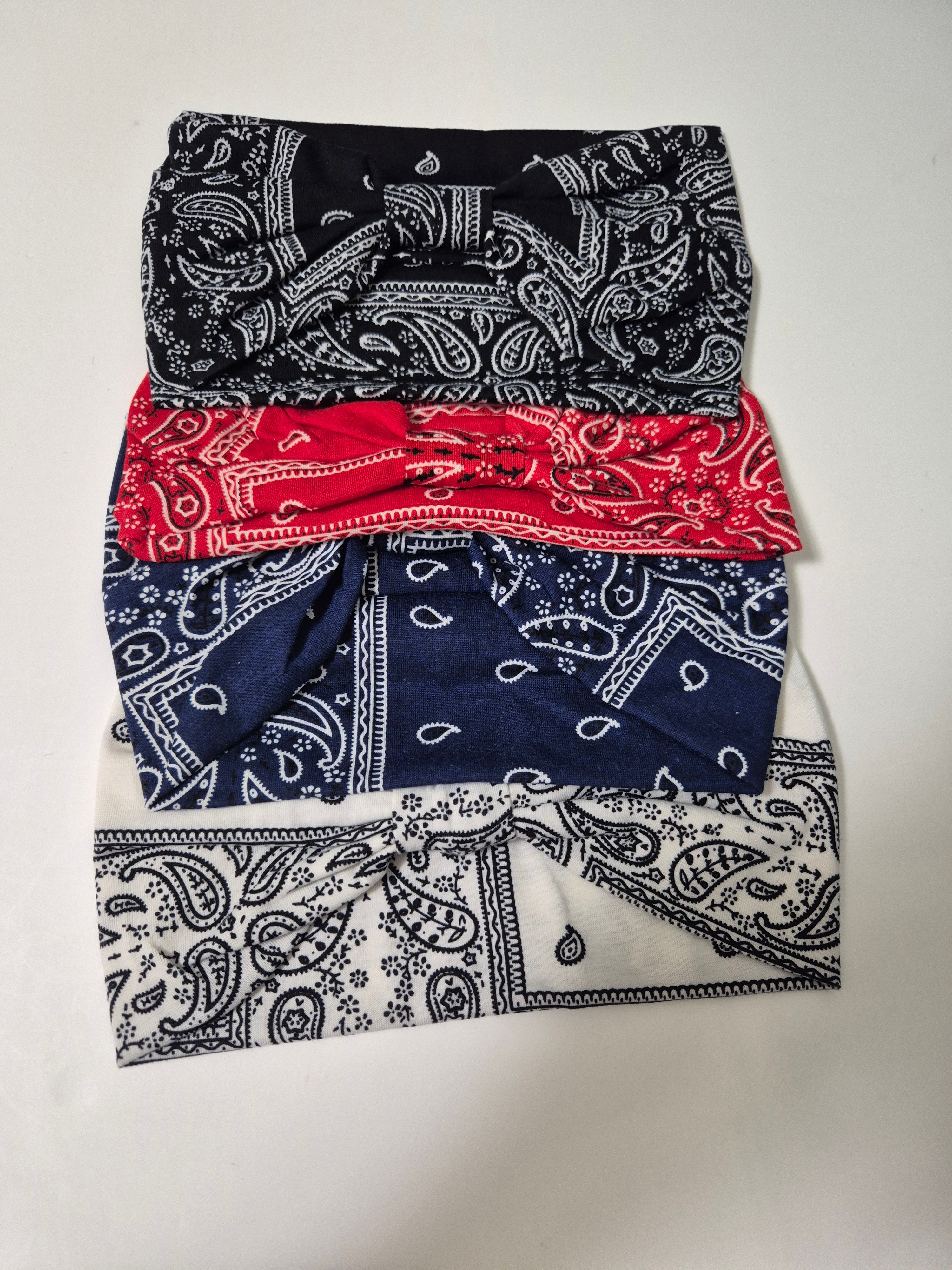Set of four Kavya wide soft elastic hairbands for women, shown in various colors, ideal for casual and active wear.