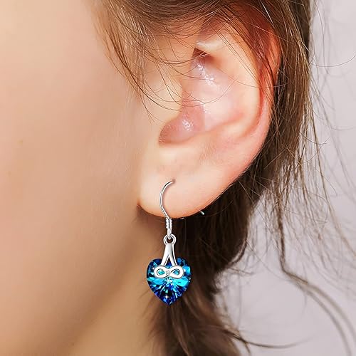 Infinionly blue crystal heart stud earrings made of 925 silver with an infinity symbol design for women and girls.