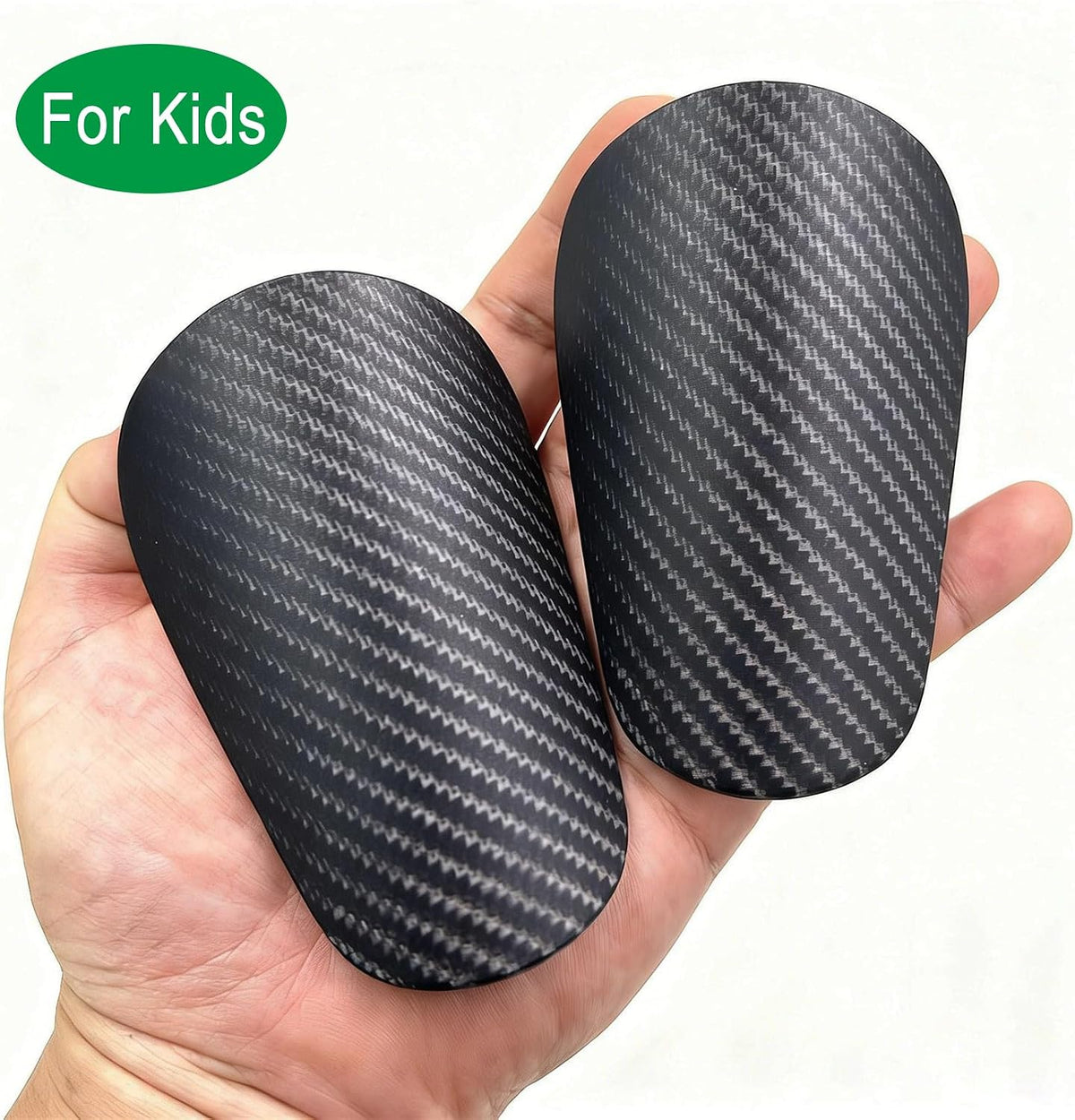 Incnmad 4x Mini football shin guards in black, ultra small 10x6cm carbon shin pads for kids and teens, shown on a flat surface.
