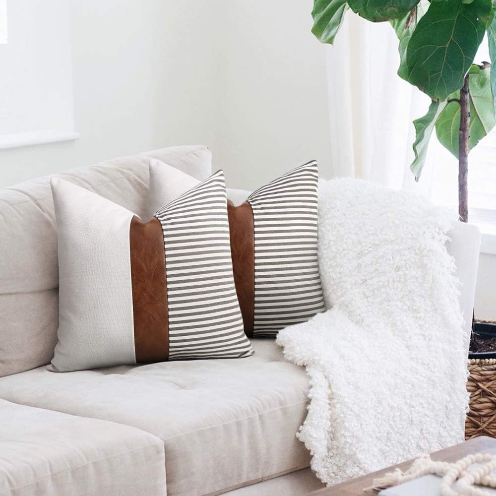 Merrycolor farmhouse navy blue and tan pillow covers set of 2 with faux leather patchwork, textured cushions for sofa and living room.