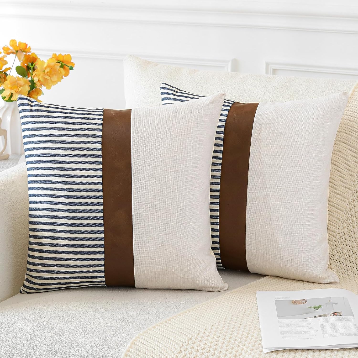 Pair of Merrycolor farmhouse navy blue and tan pillow covers with faux leather patchwork, textured cushion covers for sofa or living room.