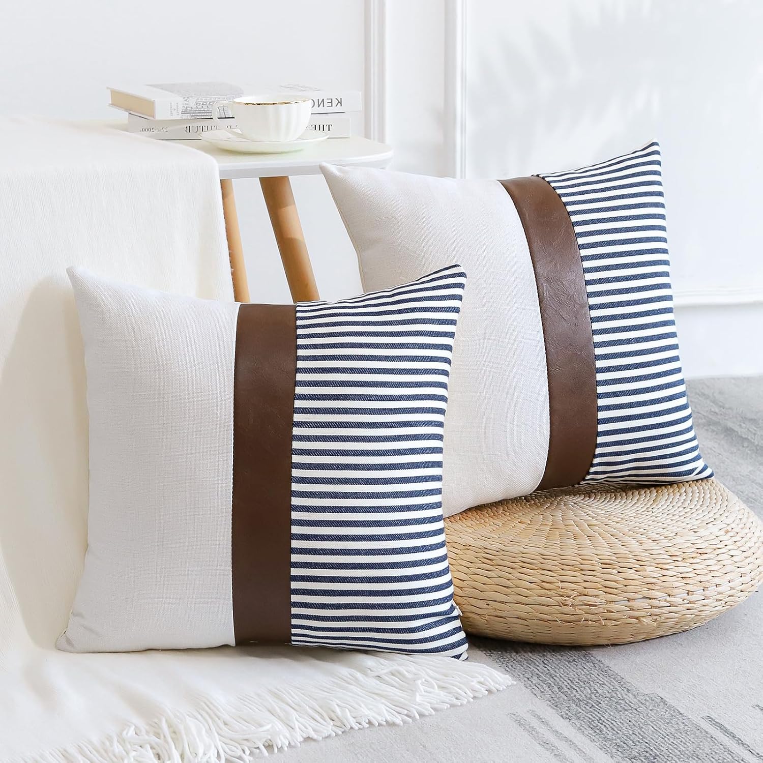 Set of two Merrycolor farmhouse navy blue and tan pillow covers with faux leather patchwork, textured cushion covers for sofa or living room.