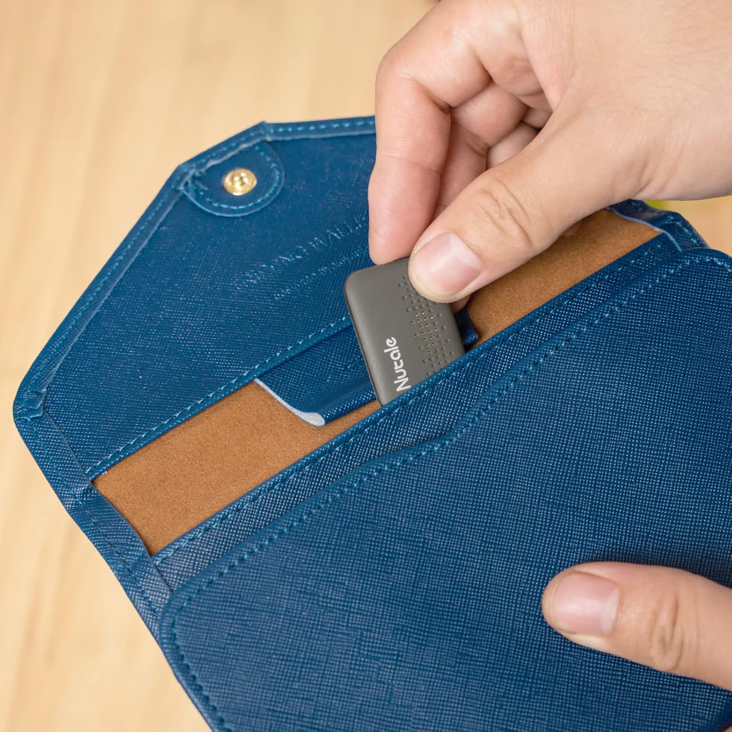 Nutale Mini Smart Finder Bluetooth key tracker and item locator for keys, wallet, and more with CR2016 battery included.