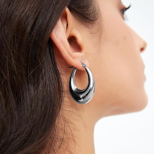Pabbeu chunky gold and silver hoop earrings for women, lightweight hypoallergenic stainless steel oval earrings in various large sizes.