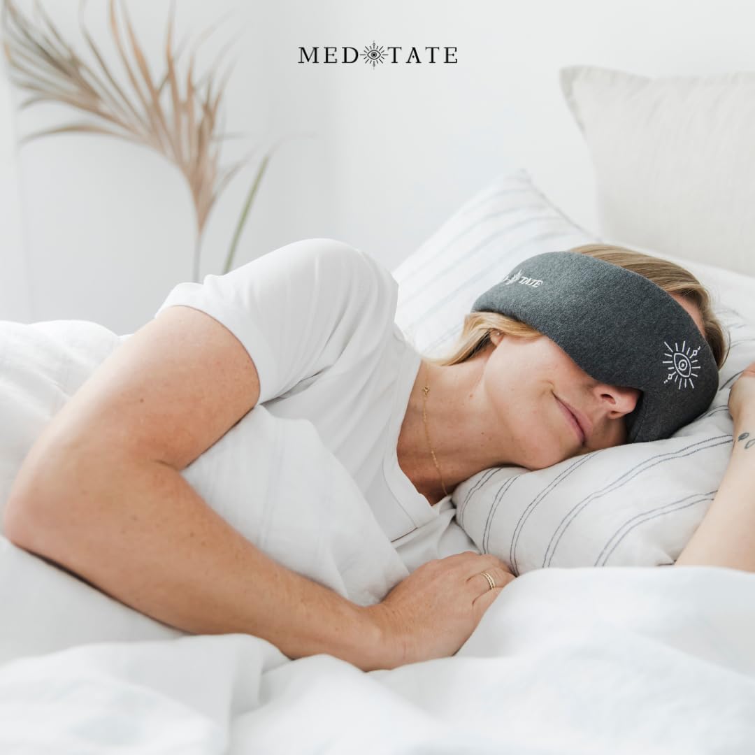 Ultra-soft black sleep mask by MEDEYETATE with adjustable fit, breathable cotton, perfect for deep sleep, travel, and relaxation.