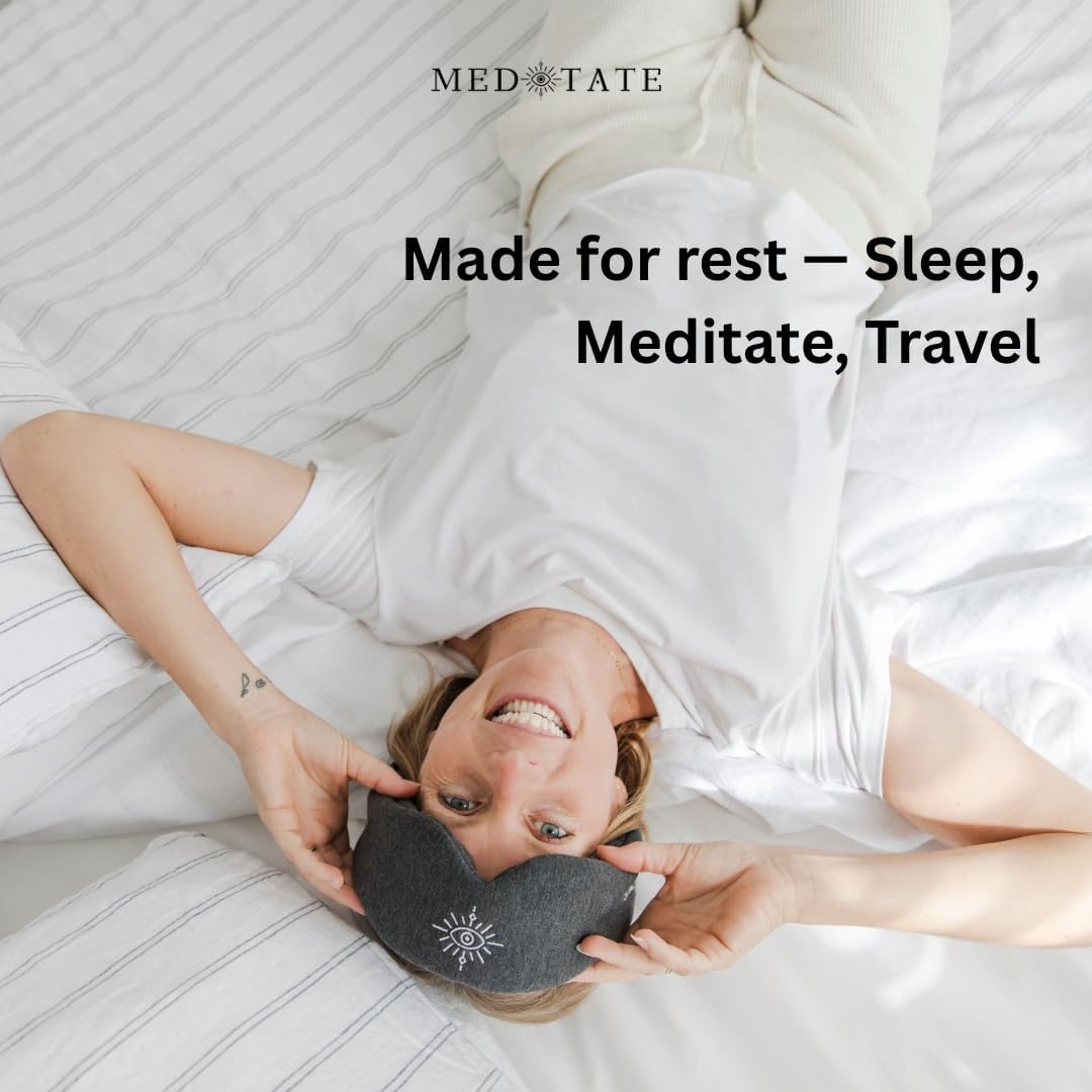 Black total blackout sleep mask by MEDEYETATE, ultra-soft cotton, adjustable, breathable eye mask for deep sleep and relaxation.