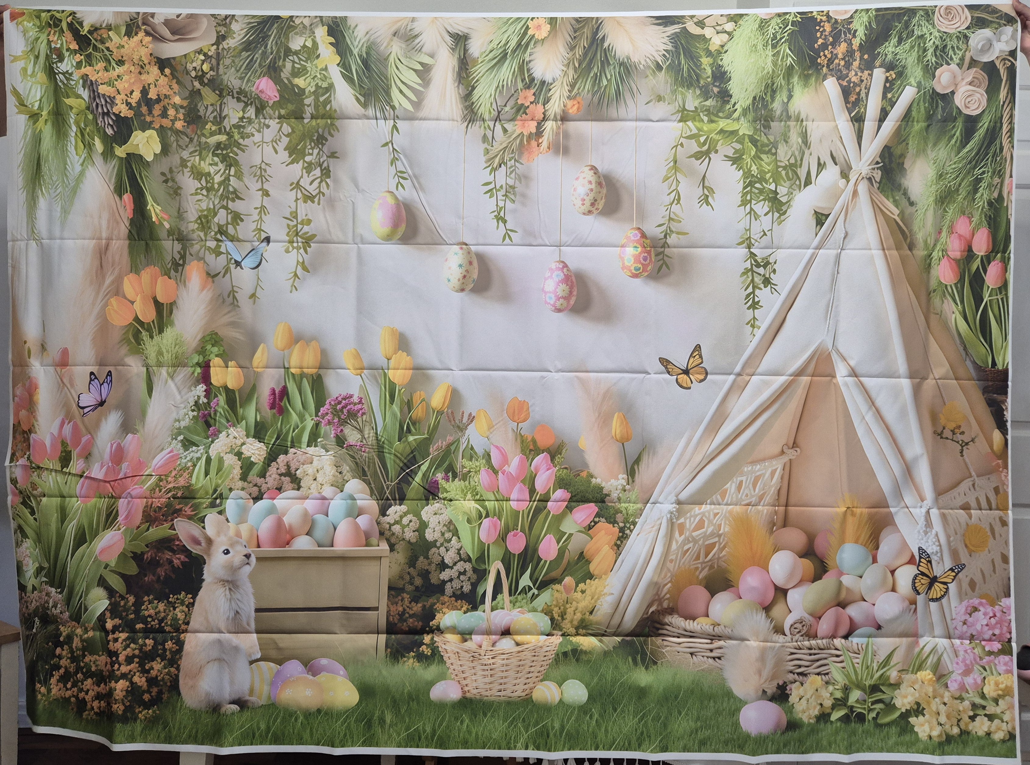 Deeying spring Easter photo backdrop with floral and pastel tent design for festive photo shoots and party decorations.